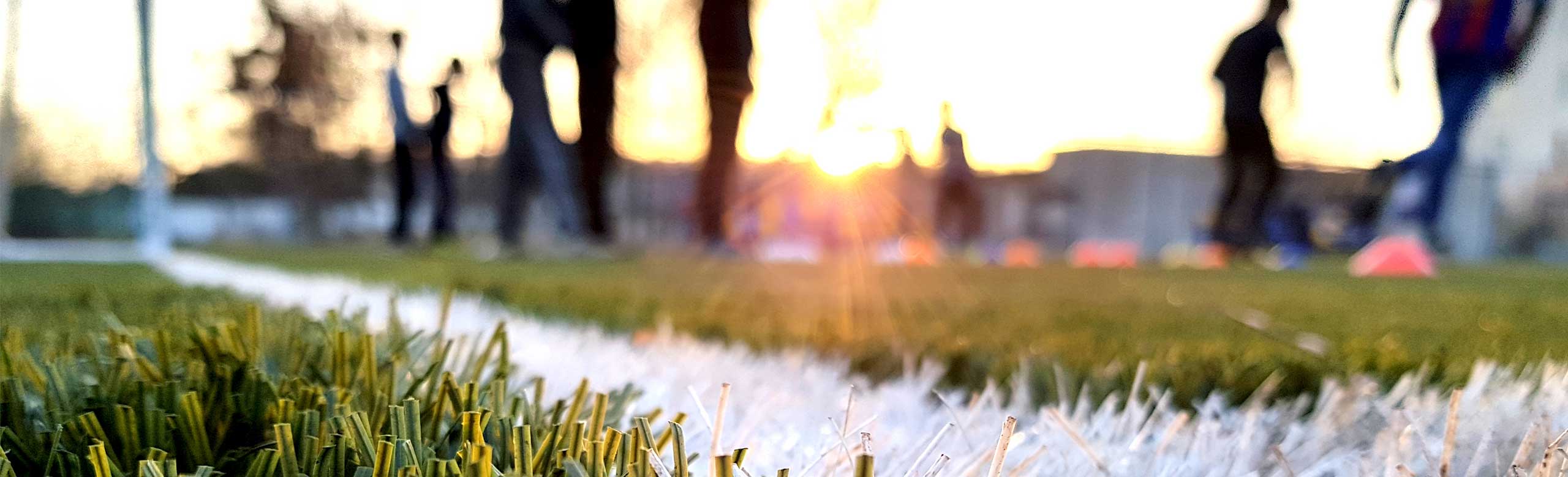 Elastic layers (shockpads) from REGUPOL under synthetic turf shock pads for synthetic turf flooring, People playing football on synthetic turf
